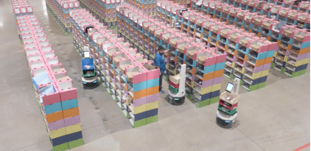 Locus Robotics’ autonomous robots at work with a picking associate