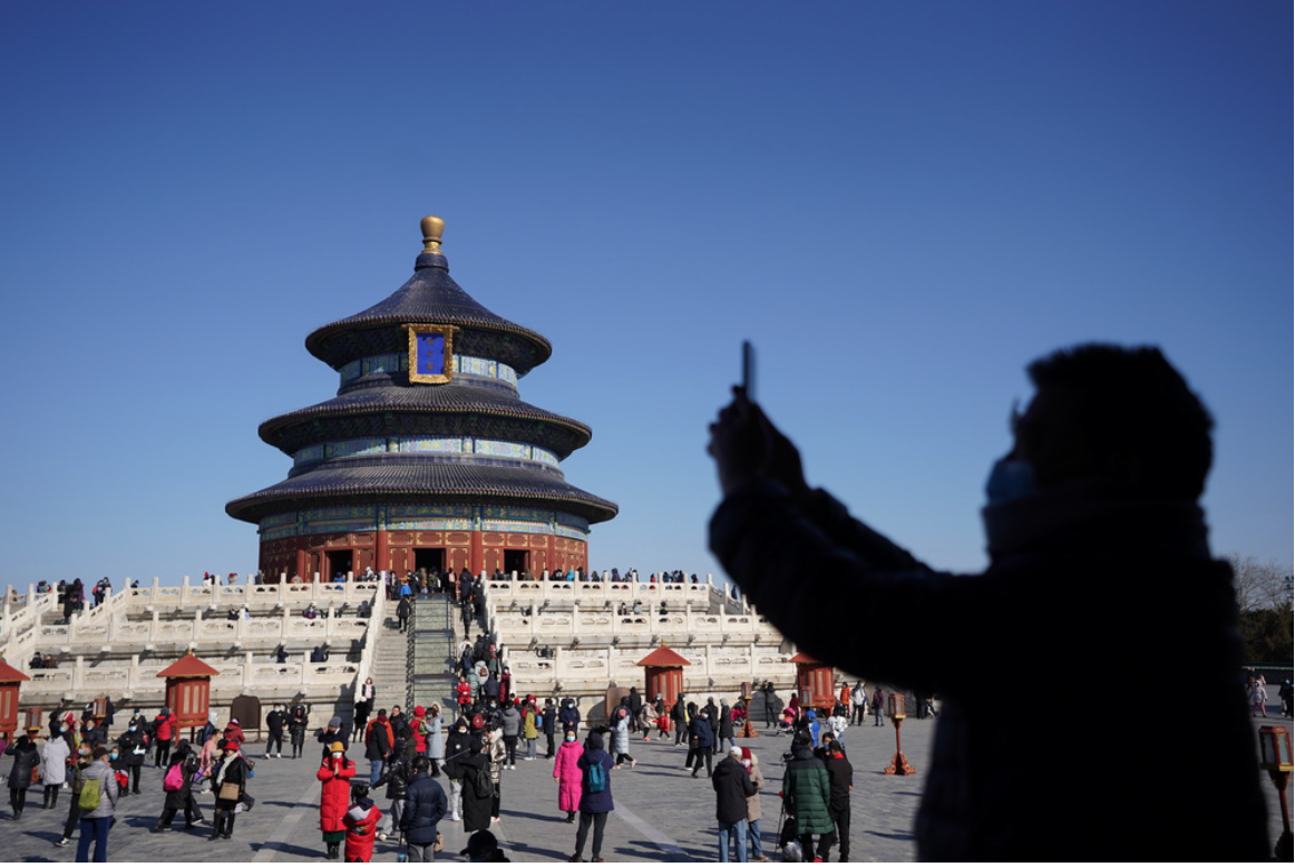 People visiting the Temple of Heaven Park in Beijing on February 17, which would typically be deserted over Chinese New Year