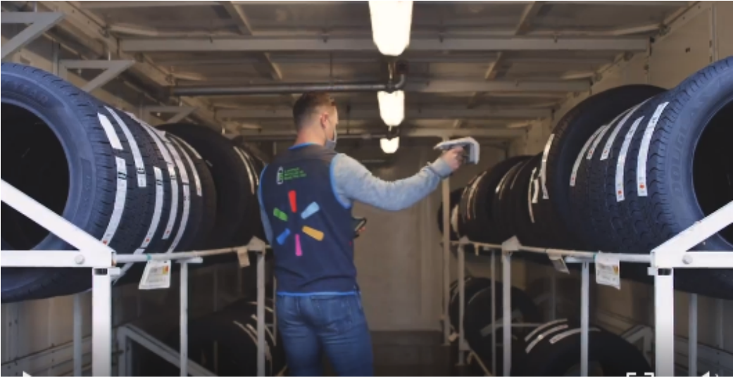 A Walmart employee using an RFID scanner to update inventory in real time