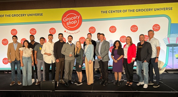 The 12 speakers and four judges that participated in the Shark Reef pitch competition at Groceryshop 2022 