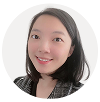 A person smiling at the camera Description automatically generated